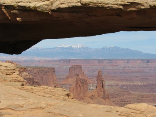 Mesa Arch with the Canyon Formations in the Background